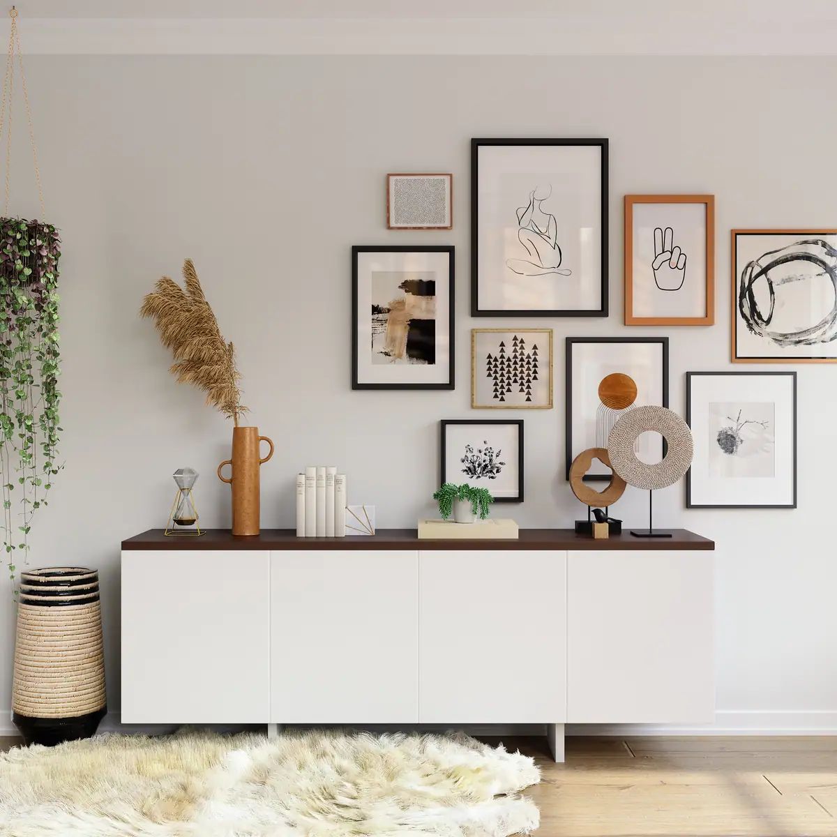 A compact living room wall with low storage, framed prints and natural textures