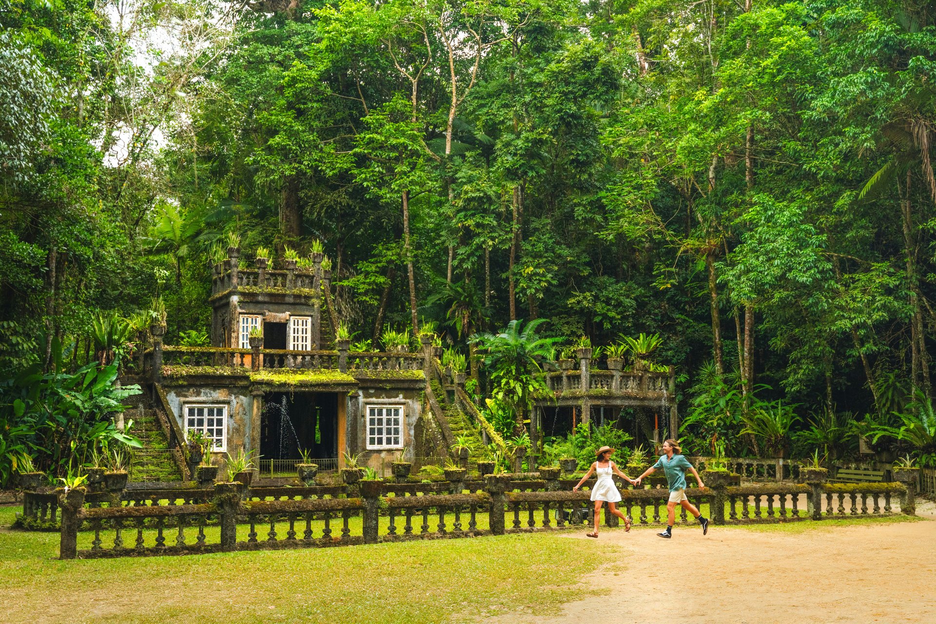 A historic building surrounded by tropical rainforest